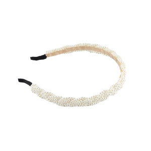 Elegant woven pearl headband with spiral beaded texture and comfortable black end tips