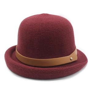 Burgundy knitted bucket hat with vintage brown leather strap and gold metal buckle