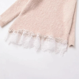Chic apricot knit sweater featuring delicate white lace trim and fuzzy mohair texture