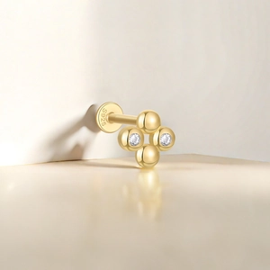 Detailed view of golden S925 sterling silver cartilage stud with inlaid zircon stones