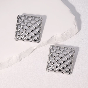 Minimalist silver quilted pattern square studs in high-polished stainless steel