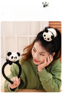 Close-up of cute plush panda headband for kids with soft black and white fur details