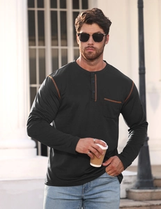 Men's charcoal grey long sleeve Henley shirt featuring bright orange contrast stitching details