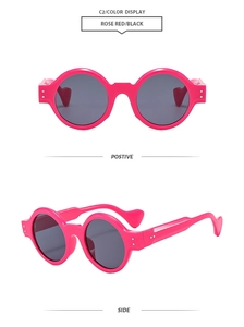 Detail view of round rose red sunglasses with thick frames and black lenses from two angles