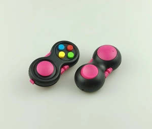 Detail of black fidget controller toys featuring colorful silicone buttons and smooth texture