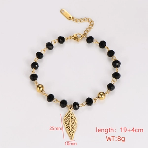 Detailed view of black beaded bracelet with gold leaf charm and dimension markings