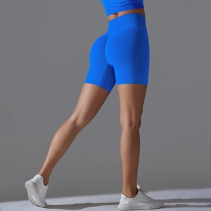 Detail view of seamless electric blue high-waisted yoga shorts with butt-lifting texture