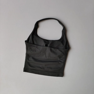 Detail of black seamless halter yoga top with breathable texture and backless design
