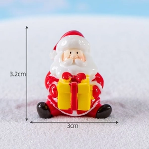 Macro shot of miniature Santa Claus figurine holding a gift box with 3.2cm size specs