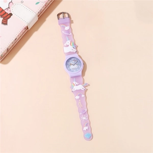 Detail of purple kids watch with 3D unicorn and rainbow relief on silicone strap