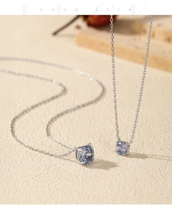Macro shot of two S925 silver necklaces with sparkling light blue rose cut gemstones