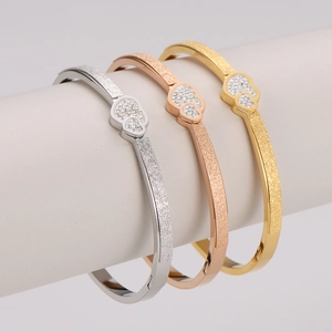 Three-piece stainless steel heart bracelets in gold, silver, and rose gold with rhinestones