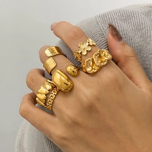 Vintage gold stainless steel rings set featuring heart and floral designs for women