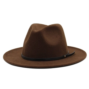 Close-up of deep brown wool fedora hat featuring black leather band and gold metal rivet detail
