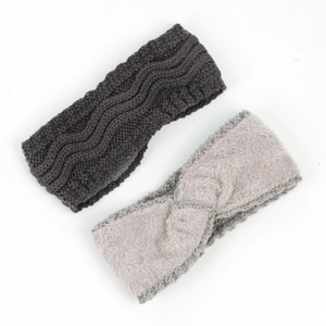 Detailed texture of thick knit grey and plush beige winter headbands with twist knot