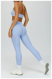 Detail view of light blue yoga set featuring a backless one-shoulder bra and high-waist leggings