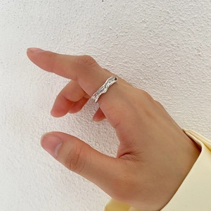 Detail showing irregular wavy texture and molten lava design of the S925 silver ring