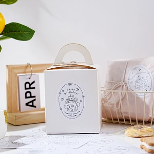 Oval happy birthday gift stickers on white packaging boxes with aesthetic lifestyle setup
