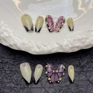 Cyberpunk black butterfly press-on nails with glitter and rhinestones in long coffin shape