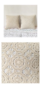 Close-up of handmade crochet cushion cover with intricate floral openwork pattern