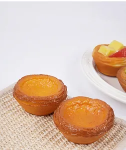 Close-up of realistic 7.5cm PU faux egg tart model with golden crust and soft texture