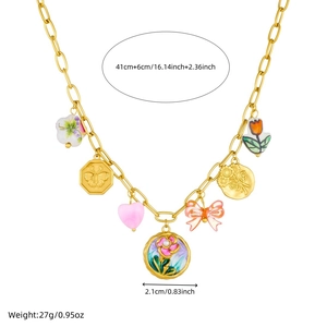 Detail view of gold enamel jewelry set with butterfly pendants and dimensions info