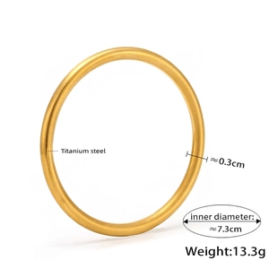 Detailed specs of the 18K gold plated titanium steel bangle showing size and weight