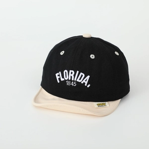 Detail of high-density FLORIDA 1845 embroidery on kids baseball cap with soft visor