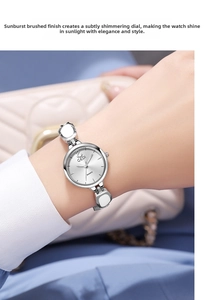 Close-up of GEDI silver quartz watch featuring a sunray brushed dial and link bracelet