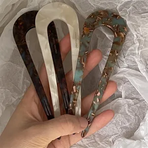Three-piece acetate U-shaped hair pins with tortoiseshell and marble patterns