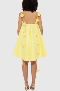 Detail of yellow satin dress with 3D floral appliqués and back view of the thin straps