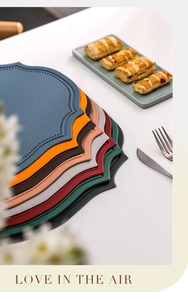 Set of scalloped faux leather placemats in multiple colors for elegant table decor