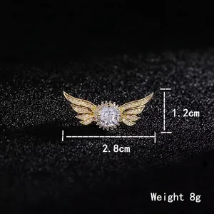 Elegant gold angel wing brooch with clear crystals and zircon center 2.8cm wide