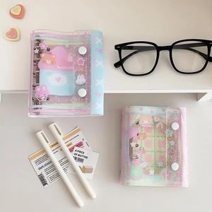 Detail of cute bear PVC mini binder in pink and blue with metal rings and snap closures