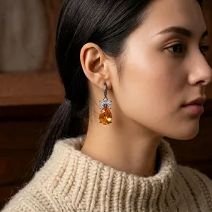 Vintage style drop earrings with pear-cut orange zircon and crystal-embellished flower detail