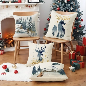 Christmas cushion covers with watercolor fox and deer prints in a cozy home setting