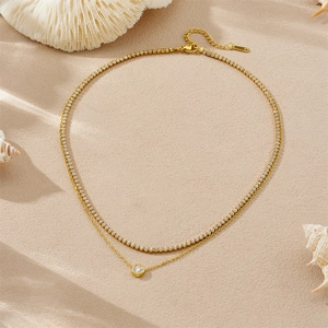 Double-layered gold stainless steel necklace with sparkling heart pendant and shell decor