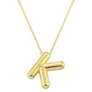 Detail view of a minimalist gold capital letter K pendant on a fine link chain necklace