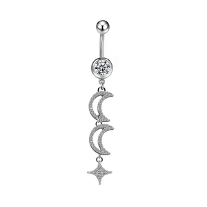 Detailed macro view of heart-shaped belly ring with moon and star zircon pendant