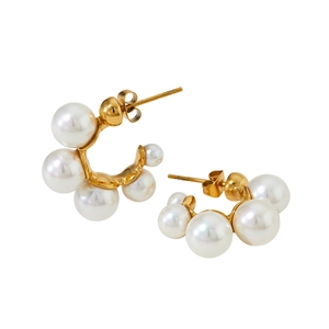 Elegant gold C-shaped stainless steel earrings featuring white pearls in a minimalist design