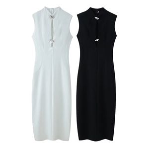 Chic sleeveless maxi dress in black and white with metallic button detail and cut-out