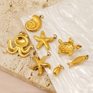 Gold plated stainless steel ocean theme charms set with starfish and turtle pendants