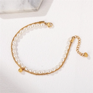 Double-layered gold chain bracelet with white pearls and adjustable lobster clasp