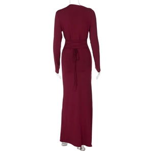 Detailed back view of burgundy long sleeve maxi dress featuring elegant lace-up tie design