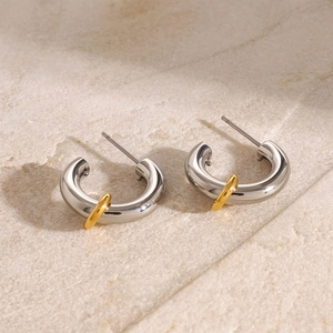Two-tone silver and 18k gold plated stainless steel C-shaped stud earrings on stone