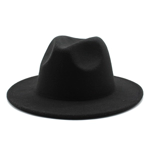 Close-up detail of smooth black wool felt texture on the wide brim fedora jazz hat