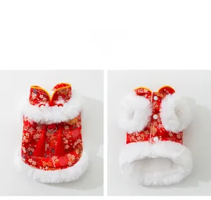 Close-up of red festive cat tang suit with floral embroidery and white faux fur trim