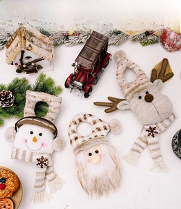 Detailed flat lay of Santa, Snowman, and Reindeer plush Christmas door handle hangers