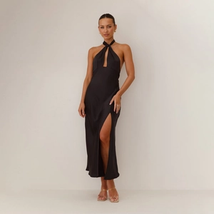 Detail of elegant black satin halter neck dress with cutout chest and high side slit