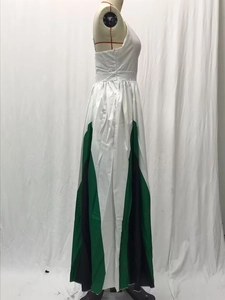 Detail of color-block pleated maxi dress showing white green and black geometric panels